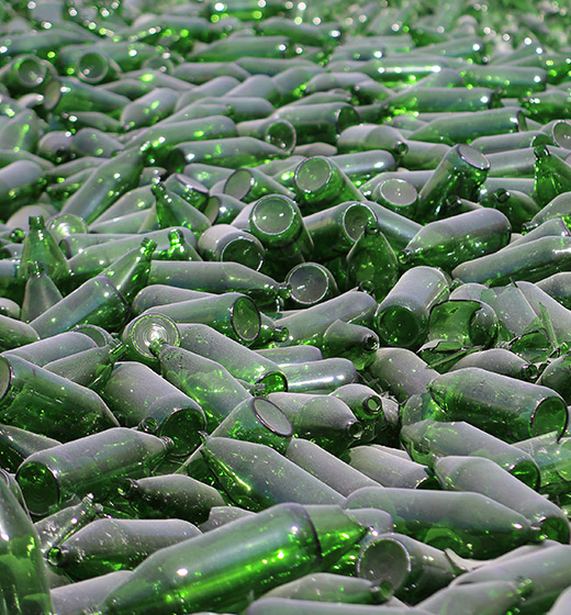 Pile of green glass bottles